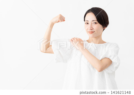 A woman wearing a white blouse - Lifestyle image A woman wearing a white blouse - Lifestyle image 141621148