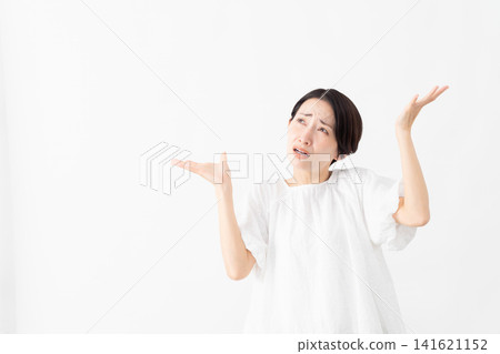 A woman wearing a white blouse - Lifestyle image A woman wearing a white blouse - Lifestyle image 141621152