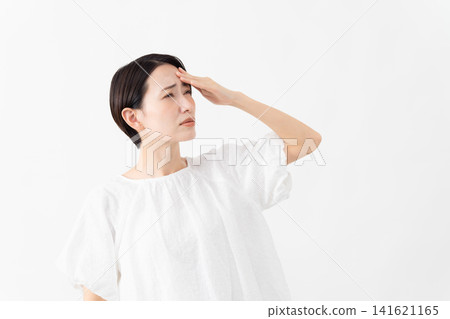 A woman wearing a white blouse - Lifestyle image A woman wearing a white blouse - Lifestyle image 141621165