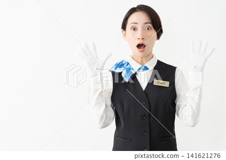 A female attendant in uniform; travel image 141621276