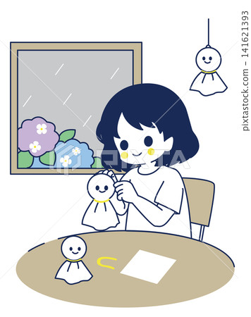 下雨天,一個女孩在製作晴天娃娃。 下雨天,一個女孩在製作晴天娃娃。 141621393