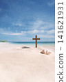 Seashells and the Cross of Jesus Christ on a seaside beach, background for church summer camps, summer Bible school, and summer retreats. 141621931