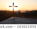 Silhouette of the Cross of Jesus Christ and the Bible, Christian faith and belief background 141621934