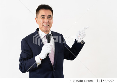 Senior man giving a campaign speech while holding a microphone Senior man giving a campaign speech while holding a microphone 141622992
