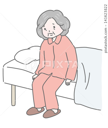An elderly woman in pajamas sits on the bed, looking dejected. An elderly woman in pajamas sits on the bed, looking dejected. 141623822