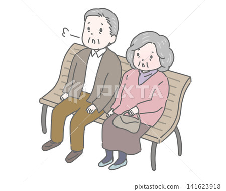 An elderly couple takes a break on a bench. An elderly couple takes a break on a bench. 141623918