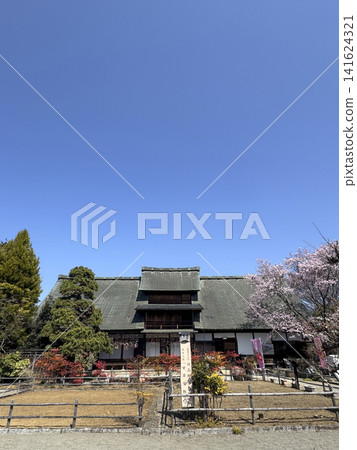 The Kanzo Mansion with cherry blossoms in full bloom The Kanzo Mansion with cherry blossoms in full bloom 141624321