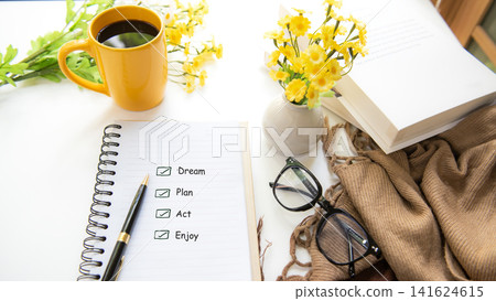 Notebook with life goals checklist on bright workspace for personal growth and future planning Notebook with life goals checklist on bright workspace for personal growth and future planning 141624615