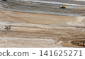 Aerial view motor grader civil at construction site, Motor grader work on construction site, Road grader on road construction site machine work on the construction of new road. 141625271