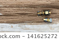 Aerial view motor grader civil at construction site, Motor grader work on construction site, Road grader on road construction site machine work on the construction of new road. 141625272
