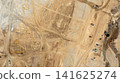 Aerial view motor grader civil at construction site, Motor grader work on construction site, Road grader on road construction site machine work on the construction of new road. 141625274