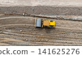 Aerial view motor grader civil at construction site, Motor grader work on construction site, Road grader on road construction site machine work on the construction of new road. 141625276