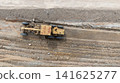 Aerial view motor grader civil at construction site, Motor grader work on construction site, Road grader on road construction site machine work on the construction of new road. 141625277
