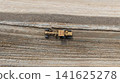 Aerial view motor grader civil at construction site, Motor grader work on construction site, Road grader on road construction site machine work on the construction of new road. 141625278
