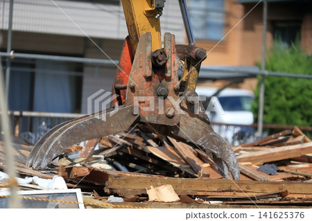 Demolition site rubble and heavy machinery Demolition site rubble and heavy machinery 141625376
