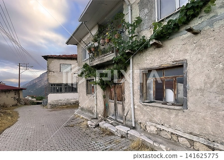 Century old village house in Harmankoy, Bilecik, nestled in green nature with rustic textures and timeless rural charm. Century old village house in Harmankoy, Bilecik, nestled in green nature with rustic textures and timeless rural charm. 141625775