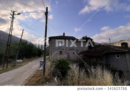 Century old village house in Harmankoy, Bilecik, nestled in green nature with rustic textures and timeless rural charm. Century old village house in Harmankoy, Bilecik, nestled in green nature with rustic textures and timeless rural charm. 141625788