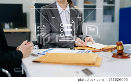 Professional attorney reviewing contract files and checklist icons, representing legal compliance, audit, and document approval. Professional attorney reviewing contract files and checklist icons, representing legal compliance, audit, and document approval. 141626093