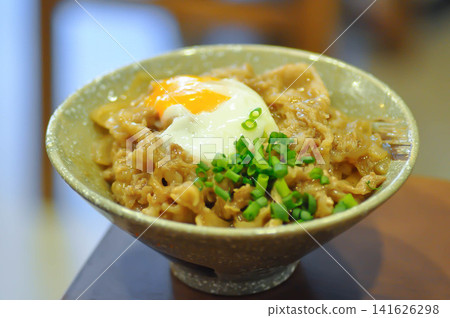 Rice topped with stir fried pork or stir fried beef and egg or Japanese food or Korean food or Beef Rice Bowl , Gyudon Rice topped with stir fried pork or stir fried beef and egg or Japanese food or Korean food or Beef Rice Bowl , Gyudon 141626298