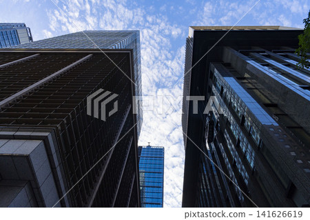 A perspective of a cityscape between buildings, perfect for business and real estate imagery. A perspective of a cityscape between buildings, perfect for business and real estate imagery. 141626619