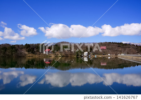 Sakuragaike Park: A chain of clouds and its reflection. Sakuragaike Park: A chain of clouds and its reflection. 141626767