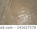 Sparkling Sunlight on Clear Seawater and Sand 141627578