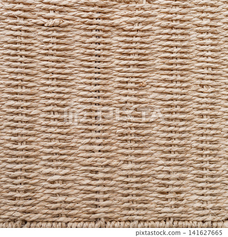 Macro texture background of beige basket woven from twisted paper rope with horizontal rows 141627665