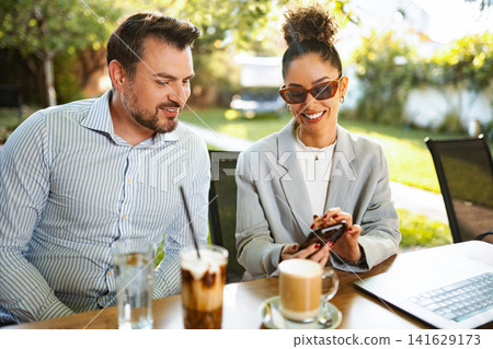 Business people having outdoor meeting, using smartphone, coffee Business people having outdoor meeting, using smartphone, coffee 141629173