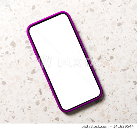 A smartphone with a blank white screen and pink frame lies diagonally on a terrazzo tile floor, A smartphone with a blank white screen and pink frame lies diagonally on a terrazzo tile floor, 141629544