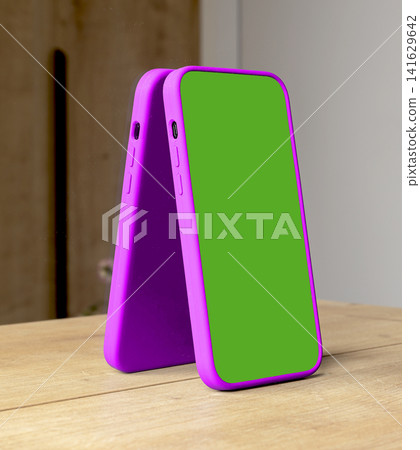 Pair of smartphone mockups with bright green chroma key screens and magenta frames lean together on Pair of smartphone mockups with bright green chroma key screens and magenta frames lean together on 141629642