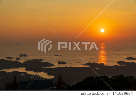 100 Scenic Views of Japan: A breathtaking view of the sunset from Yumiharidake Observatory in Sasebo City, Nagasaki Prefecture. 100 Scenic Views of Japan: A breathtaking view of the sunset from Yumiharidake Observatory in Sasebo City, Nagasaki Prefecture. 141629694
