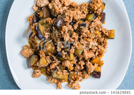 Stir-fried eggplant and ground meat with meat miso sauce - a sweet and savory home-style dish. Stir-fried eggplant and ground meat with meat miso sauce - a sweet and savory home-style dish. 141629891