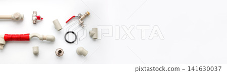 A flat lay composition of various plumbing supplies, including plastic pipes, fittings, valves, and connectors on a white background with empty copy space, illustrating plumbing, heating installation A flat lay composition of various plumbing supplies, including plastic pipes, fittings, valves, and connectors on a white background with empty copy space, illustrating plumbing, heating installation 141630037