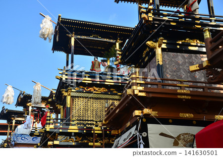 Inuyama City, Aichi Prefecture, Japan: The Inuyama Festival in spring under a clear blue sky; the floats gathered in front of Inuyama Castle Square, and the scene of the mechanical dolls being offered as a dedication. Inuyama City, Aichi Prefecture, Japan: The Inuyama Festival in spring under a clear blue sky; the floats gathered in front of Inuyama Castle Square, and the scene of the mechanical dolls being offered as a dedication. 141630501