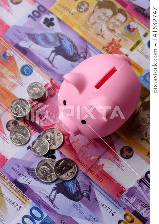 A piggy bank as a concept for storing, accumulating, and saving financial resources. A piggy bank A piggy bank as a concept for storing, accumulating, and saving financial resources. A piggy bank 141632747