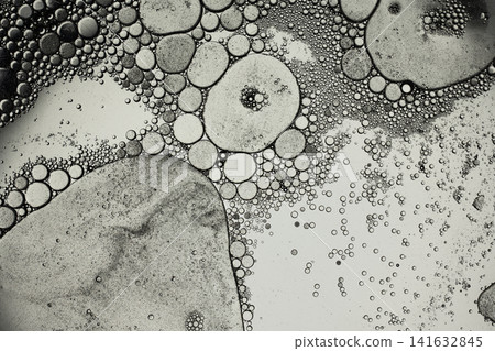 Oil and water emulsion with floating bubbles forming a unique abstract background 141632845