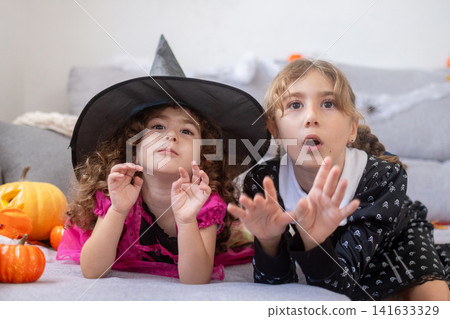 Girls in Halloween costumes Girls in Halloween costumes 141633329