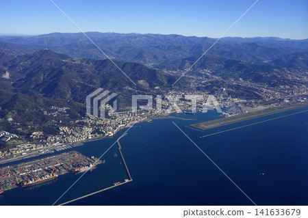 Aerial View of Genoa Coastline With Airport Runway, Port and Mountainous Urban Landscape 141633679