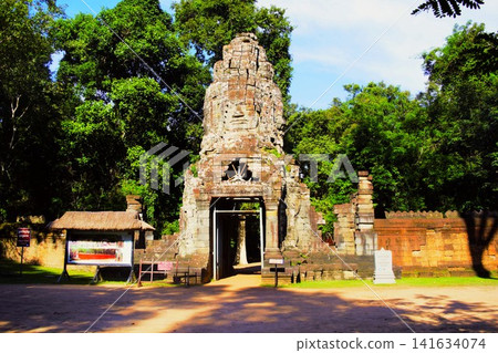 Western entrance to Ta Prohm, part of the Angkor archaeological complex. Western entrance to Ta Prohm, part of the Angkor archaeological complex. 141634074