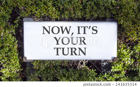 Now it's your turn words symbol. Concept words Now it's your turn on beautiful white sign plate. Beautiful green trees background. Business Now it's your turn motivational support concept Copy space Now it's your turn words symbol. Concept words Now it's your turn on beautiful white sign plate. Beautiful green trees background. Business Now it's your turn motivational support concept Copy space 141635314