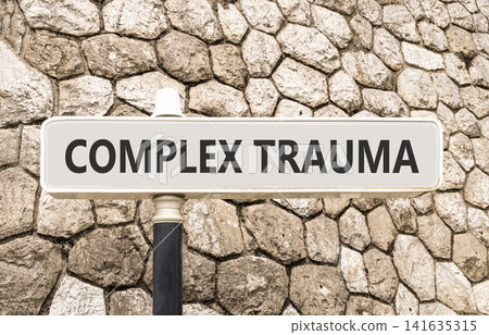 Complex trauma words symbol. Concept words Complex trauma on beautiful grey road sign. Beautiful stone wall background. Psychological complex trauma support concept. Copy space. Complex trauma words symbol. Concept words Complex trauma on beautiful grey road sign. Beautiful stone wall background. Psychological complex trauma support concept. Copy space. 141635315