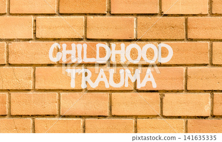 Childhood trauma words symbol. Concept words Childhood trauma on beautiful brick wall. Beautiful brick wall background. Psychological childhood trauma support concept. Copy space. Childhood trauma words symbol. Concept words Childhood trauma on beautiful brick wall. Beautiful brick wall background. Psychological childhood trauma support concept. Copy space. 141635335