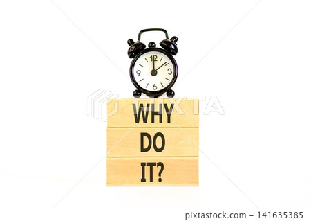 Why do it words symbol. Concept words Why do it on beautiful wooden blocks. Beautiful white background. Black alarm clock. Business support motivational and Why do it concept. Copy space. Why do it words symbol. Concept words Why do it on beautiful wooden blocks. Beautiful white background. Black alarm clock. Business support motivational and Why do it concept. Copy space. 141635385