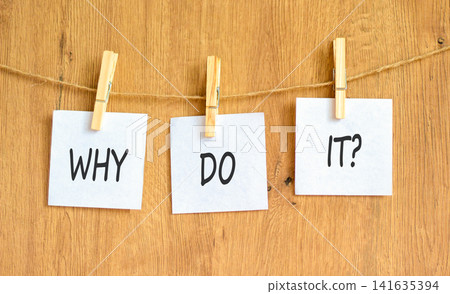Why do it words symbol. Concept words Why do it on beautiful white papers on wooden clothespin. Beautiful wooden background. Business support motivational and Why do it concept. Copy space. Why do it words symbol. Concept words Why do it on beautiful white papers on wooden clothespin. Beautiful wooden background. Business support motivational and Why do it concept. Copy space. 141635394