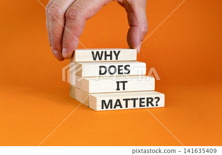 Why does it matter words symbol. Concept words Why does it matter on beautiful wooden blocks. Beautiful orange background. Businessman hand. Business support why does it matter concept. Copy space. Why does it matter words symbol. Concept words Why does it matter on beautiful wooden blocks. Beautiful orange background. Businessman hand. Business support why does it matter concept. Copy space. 141635409