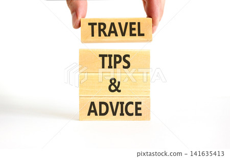Travel tips and advice words symbol. Concept words Travel tips and advice on beautiful wooden blocks. Beautiful white background. Business lifestyle travel tips and advice concept. Copy space. Travel tips and advice words symbol. Concept words Travel tips and advice on beautiful wooden blocks. Beautiful white background. Business lifestyle travel tips and advice concept. Copy space. 141635413