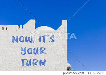 Now it's your turn words symbol. Concept words Now it's your turn on beautiful white wall. Beautiful blue sky background. Business Now it's your turn motivational support concept Copy space Now it's your turn words symbol. Concept words Now it's your turn on beautiful white wall. Beautiful blue sky background. Business Now it's your turn motivational support concept Copy space 141635540