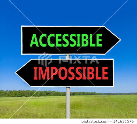 Accessible or impossible symbol. Concept words Accessible or Impossible on beautiful black road sign. Beautiful blue sky background. Business accessible or impossible concept. Copy space. Accessible or impossible symbol. Concept words Accessible or Impossible on beautiful black road sign. Beautiful blue sky background. Business accessible or impossible concept. Copy space. 141635576