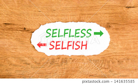 Selfless instead selfish words symbol. Concept words Selfless Selfish on beautiful white paper. Beautiful wooden background. Business medical psychology selfless selfish concept. Copy space. Selfless instead selfish words symbol. Concept words Selfless Selfish on beautiful white paper. Beautiful wooden background. Business medical psychology selfless selfish concept. Copy space. 141635585