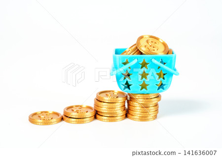 Rising stacks of gold coins form a growth chart with a blue shopping basket full of money on top. Concept of retail success, wealth accumulation, and investment growth on a white background. Rising stacks of gold coins form a growth chart with a blue shopping basket full of money on top. Concept of retail success, wealth accumulation, and investment growth on a white background. 141636007